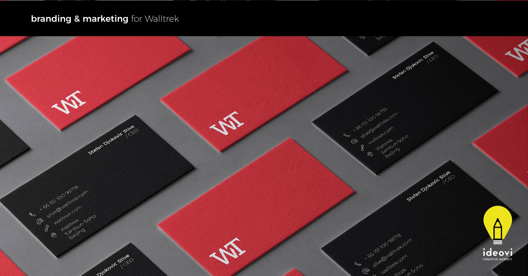 Rozłożone wizytówki firmy Walltrek w kolorach czerwonym i czarnym, z logo WT i danymi kontaktowymi Stefana Djokovica (CEO) na szarym tle.