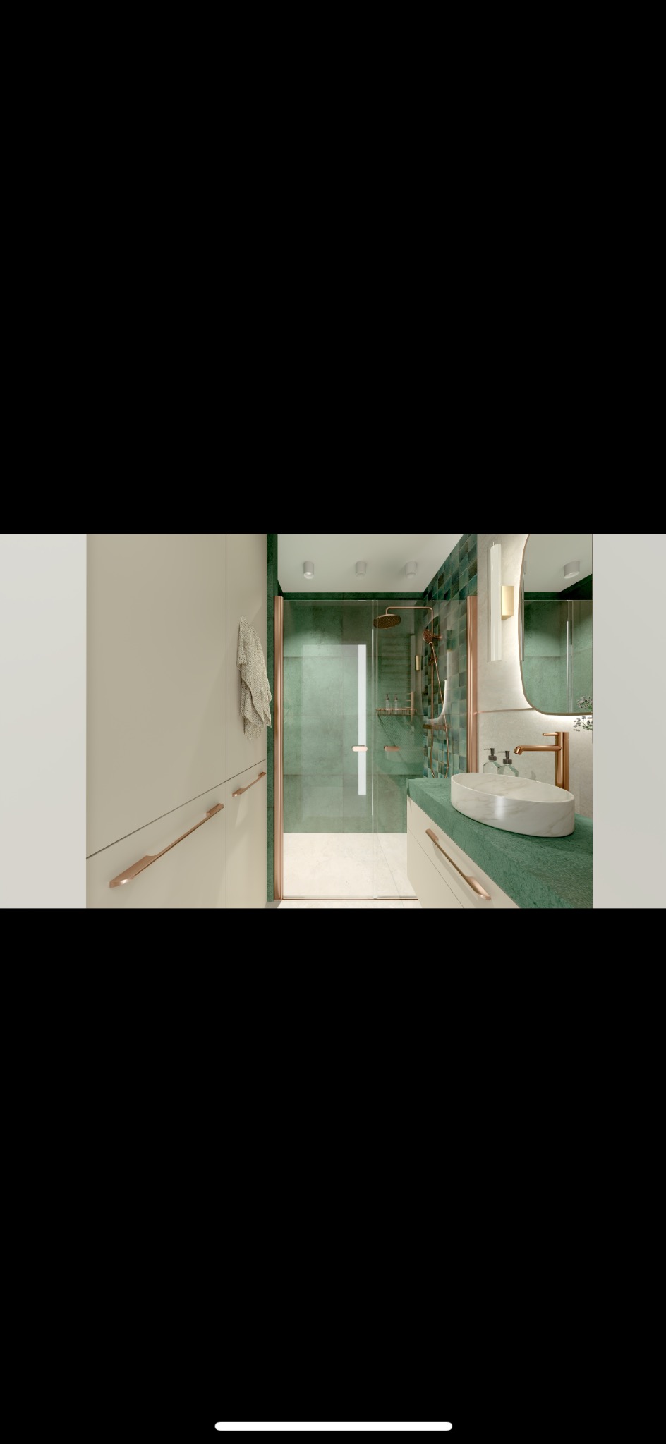 Nowoczesna łazienka z zielonymi płytkami i miedzianymi akcentami: kabina prysznicowa ze szklanymi drzwiami, umywalka nablatowa z zielonym blatem, podświetlane lustro owalne, beżowe szafki...