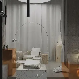 Wnętrze butiku z elementami wykonanymi na wymiar: marmurowe bloki, miedziane podesty, minimalistyczne oświetlenie i rattanowe krzesła.