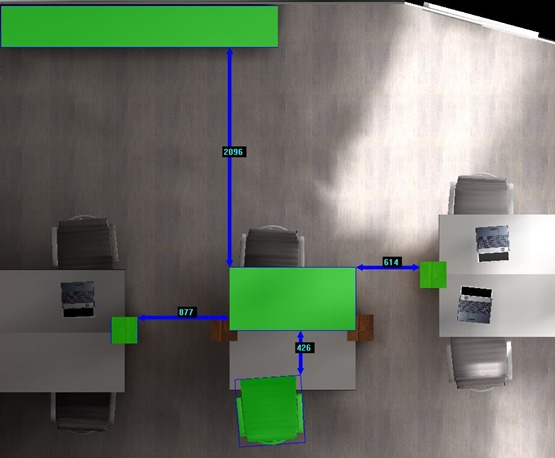 Schemat rozplanowania przestrzeni biurowej z góry, z zaznaczonymi wymiarami i odległościami między biurkami i elementami wyposażenia.