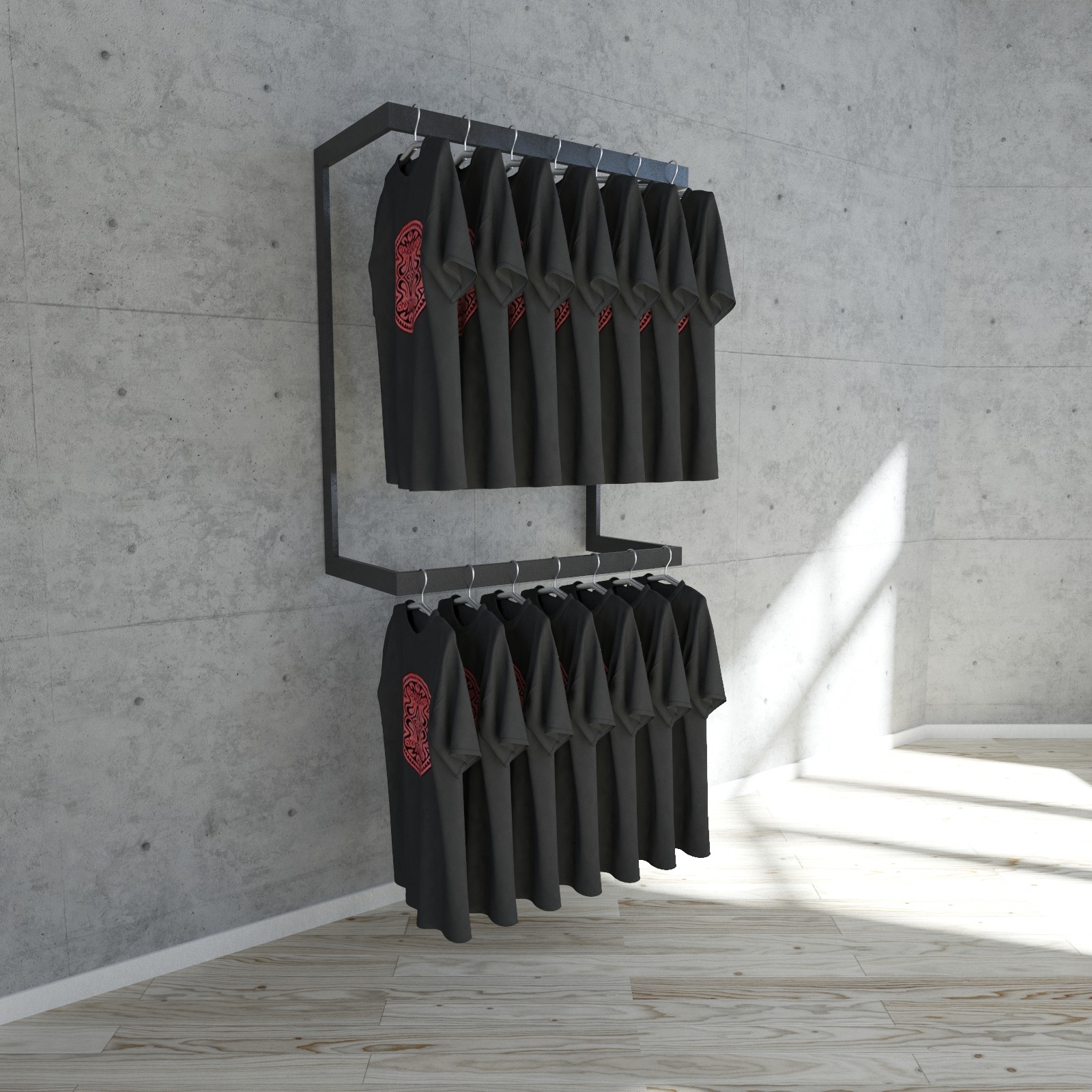 Dwu-poziomowy, metalowy wieszak na ubrania z czarnymi koszulkami z czerwonym nadrukiem, na tle surowej, betonowej ściany i drewnianej podłogi, oświetlonej naturalnym światłem.