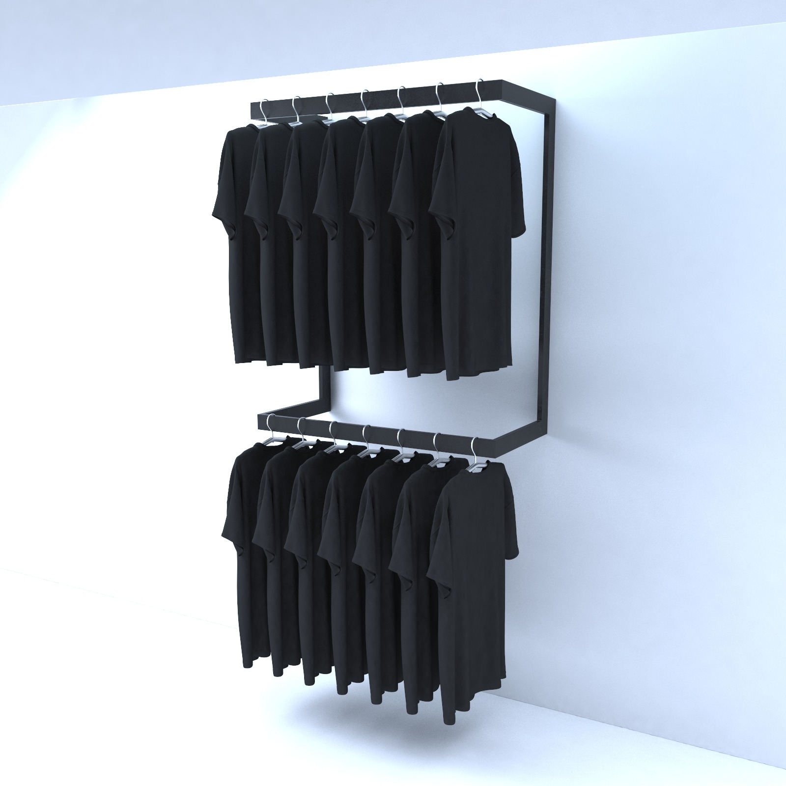 Dwu-poziomowy, minimalistyczny wieszak na ubrania z czarną ramą, prezentujący kolekcję czarnych T-shirtów na białym tle.