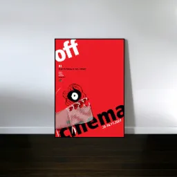 Plakat filmowy w czarnej ramie, oparty o białą ścianę na ciemnej drewnianej podłodze, z czerwonym tłem i czarnymi oraz białymi elementami graficznymi, promujący XI Międzynarodowy Festiwal Filmowy...