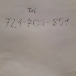 Numer telefonu 721-705-851 napisany ręcznie na kartce papieru, z dopiskiem 'Tel' powyżej.