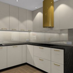 IMPRESA INTERIOR Andrzej Jerominek - Nowoczesna kuchnia w Lublińcu z beżowymi szafkami, czarnym blatem i złotymi akcentami, w tym okrągły okap. Widoczny fragment salonu z drewnianą ścianą.