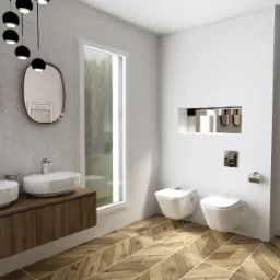 Nowoczesna łazienka z dwoma umywalkami nablatowymi na drewnianej szafce, podwieszanymi toaletami, drewnianą podłogą ułożoną w jodełkę i dwoma owalnymi lustrami z podświetleniem, wiszącymi...