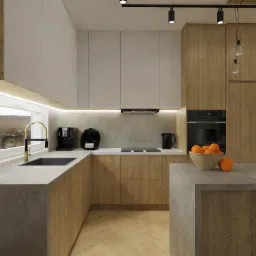 Nowoczesna kuchnia z drewnianymi i białymi szafkami, szarym blatem, złotą baterią i owocami w misce na wyspie kuchennej.