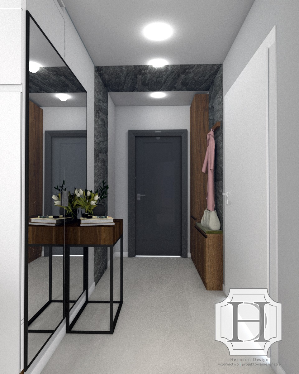 Wizualizacja przestronnego przedpokoju z szarą tapetą imitującą kamień, lustrem w czarnej ramie, drewnianą konsolą z kwiatami i szafką na buty z wieszakiem na ubrania. Logo firmy projektowej...