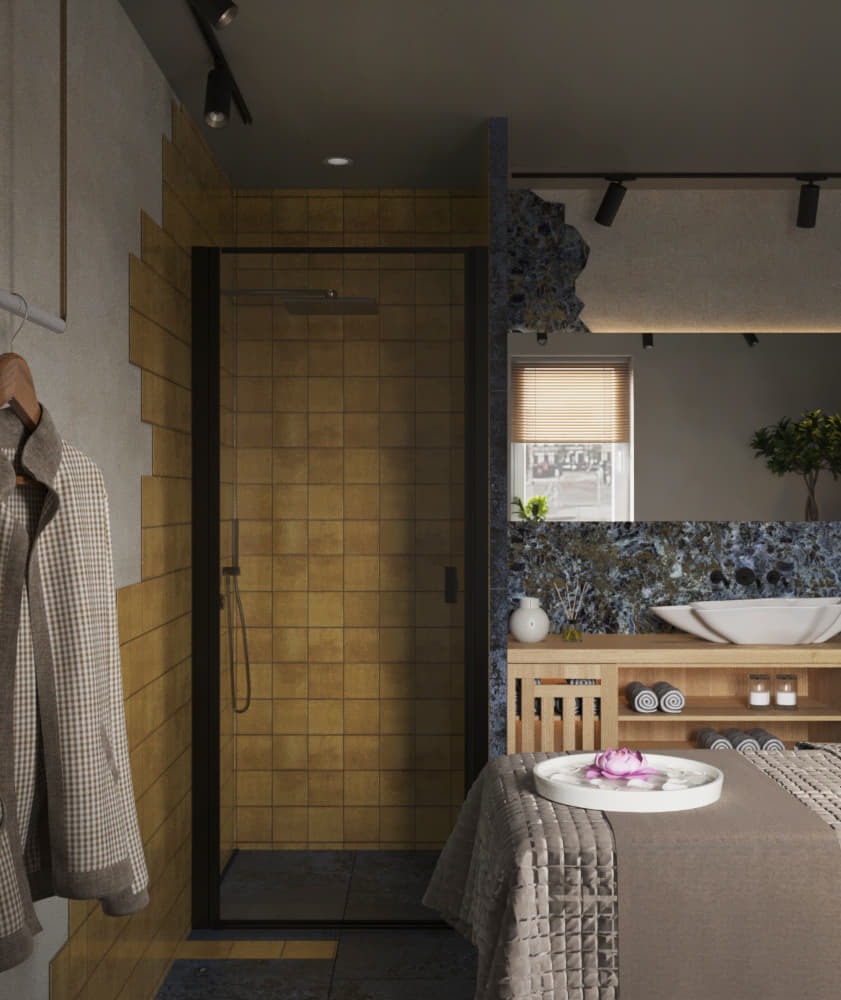 Nowoczesna łazienka z kabiną prysznicową wyłożoną kwadratowymi, złotymi płytkami, umywalką wpuszczoną w drewniany blat z szafką, oraz dekoracyjnym stołem z kwiatem lotosu.