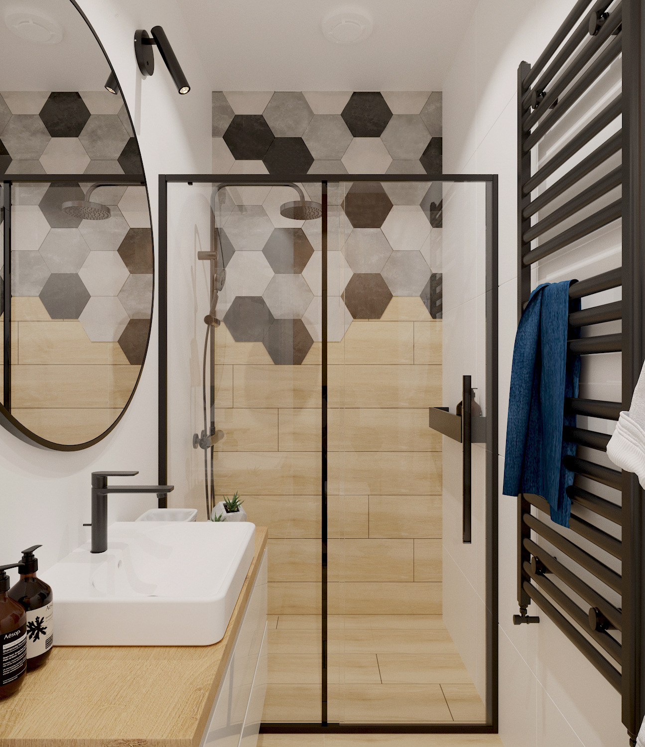 Nowoczesna łazienka z kabiną prysznicową typu walk-in, heksagonalnymi płytkami w odcieniach szarości i drewna, czarną armaturą i owalnym lustrem.
