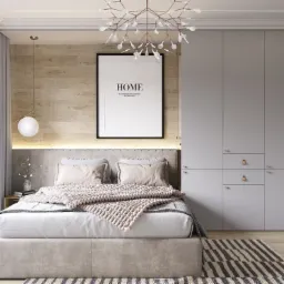 Nowoczesna sypialnia z łóżkiem kontynentalnym, drewnianą ścianą za wezgłowiem i minimalistyczną szafą w zabudowie.