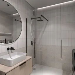 Wizualizacja łazienki z okrągłym lustrem z podświetleniem LED, białą umywalką nablatową na drewnianej szafce, kabiną prysznicową typu walk-in z czarną armaturą i płytkami w dwóch odcieniach: białym...
