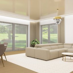 LA CASA STUDIO Iwona Wolska - Jasne, przestronne wnętrze: beżowa sofa narożna, stół z krzesłami, kryształowe lampy, obraz baletnicy. Duże okna z widokiem na zieleń. Nowoczesny design.