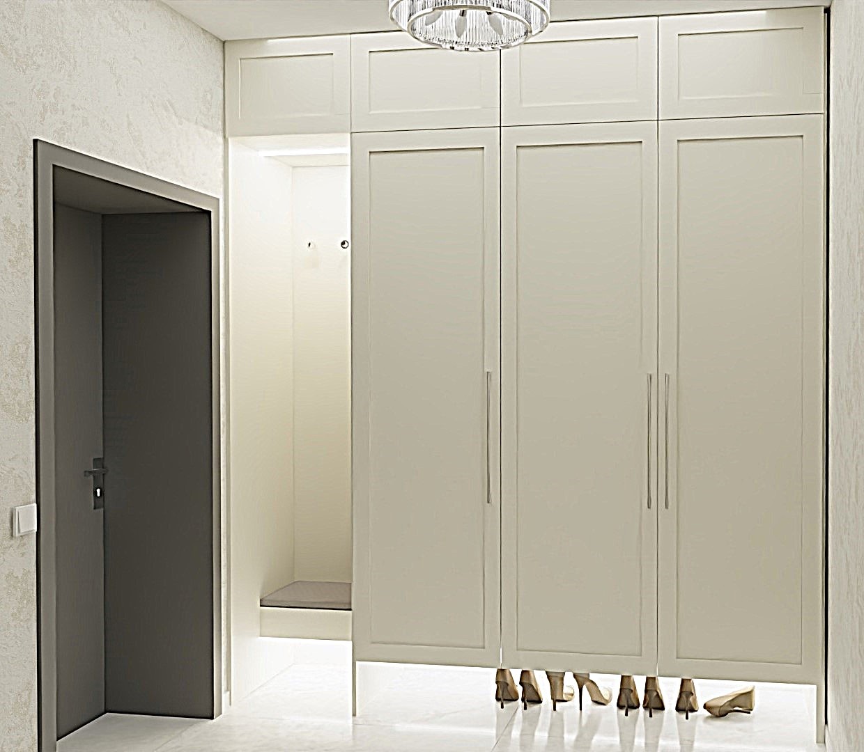 Jasne wnętrze przedpokoju z szafą w zabudowie i szpilkami pod nią. Minimalistyczny design, neutralna kolorystyka, eleganckie oświetlenie i ciemne drzwi wejściowe.