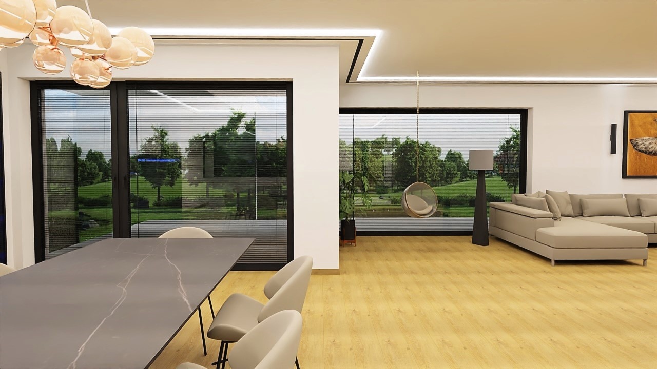 Wnętrze jasnego salonu z dużymi oknami na ogród. W centralnej części stół z krzesłami, w tle sofa narożna i wiszący fotel.