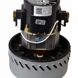 Silnik odkurzacza o mocy 1000W, z widoczną turbiną chłodzącą, uzwojeniami i srebrną obudową z otworami wentylacyjnymi na białym tle.