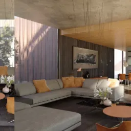 Przestronny salon z szarymi sofami narożnymi, pomarańczowymi akcentami w postaci poduszek i foteli, centralnie umieszczonym nowoczesnym kominkiem wiszącym oraz dużymi oknami z widokiem na zieleń.