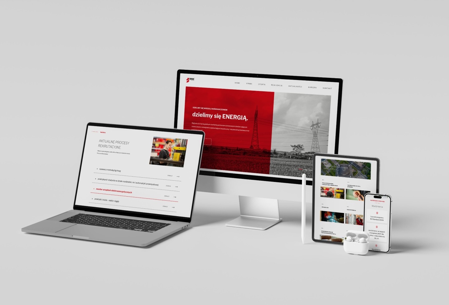 Responsywna strona internetowa firmy energetycznej wyświetlana na laptopie, monitorze, tablecie i smartfonie, podkreślająca spójną identyfikację wizualną na różnych urządzeniach.
