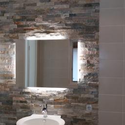 KAMEL Mariusz Kamela - ściana z kamienia naturalnego podgrzewana folią grzewczą 'Termofol'