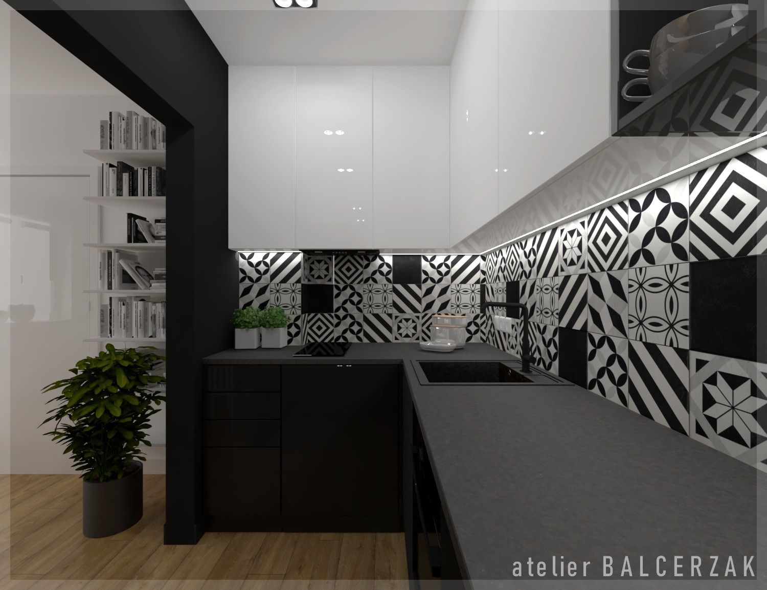 Nowoczesna kuchnia w czerni i bieli z wzorzystymi płytkami, oświetleniem LED pod szafkami i roślinami doniczkowymi, widok na regał z książkami w sąsiednim pomieszczeniu.