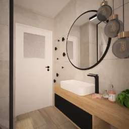 Wizualizacja nowoczesnej łazienki z drewnianym blatem, umywalką nablatową, okrągłym lustrem z czarną ramą i wiszącymi lampami w stylu industrialnym, ściany wykończone płytkami imitującymi kamień.