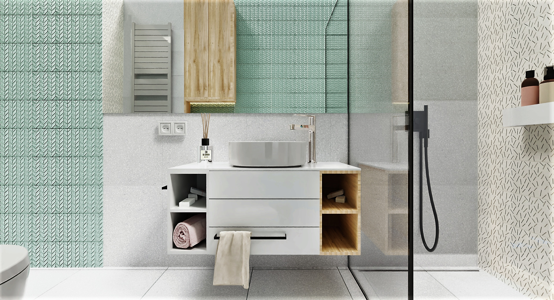 Nowoczesna łazienka z okrągłą umywalką nablatową, białą szafką z drewnianymi akcentami, kabiną prysznicową ze szklaną ścianą i deszczownicą, oraz dekoracyjnymi płytkami w odcieniach zieleni i bieli.