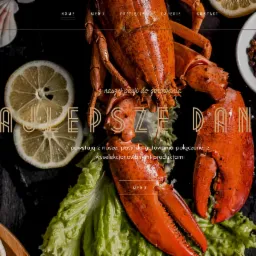 Strona internetowa restauracji Weranda z homarem, cytryną i ziarnami pieprzu na ciemnym tle.