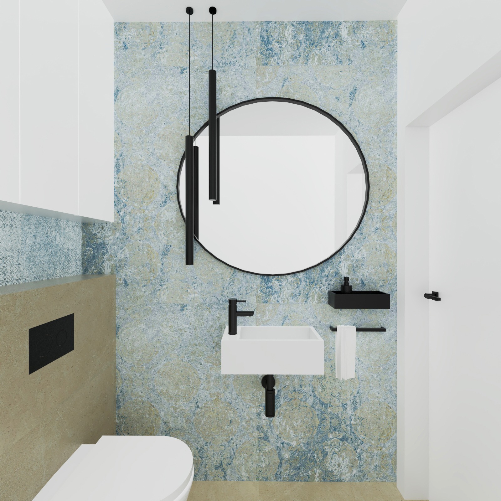 Nowoczesna łazienka z okrągłym lustrem, białą umywalką i toaletą, akcentami w kolorze czarnym i tapetą w odcieniach błękitu i beżu.