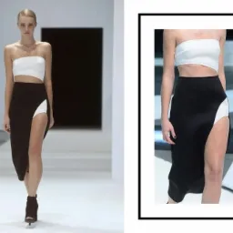 Modelka prezentuje czarno-biały komplet: krótki top bez ramiączek i długa spódnica z wysokim rozcięciem, na wybiegu z minimalistycznym tłem.