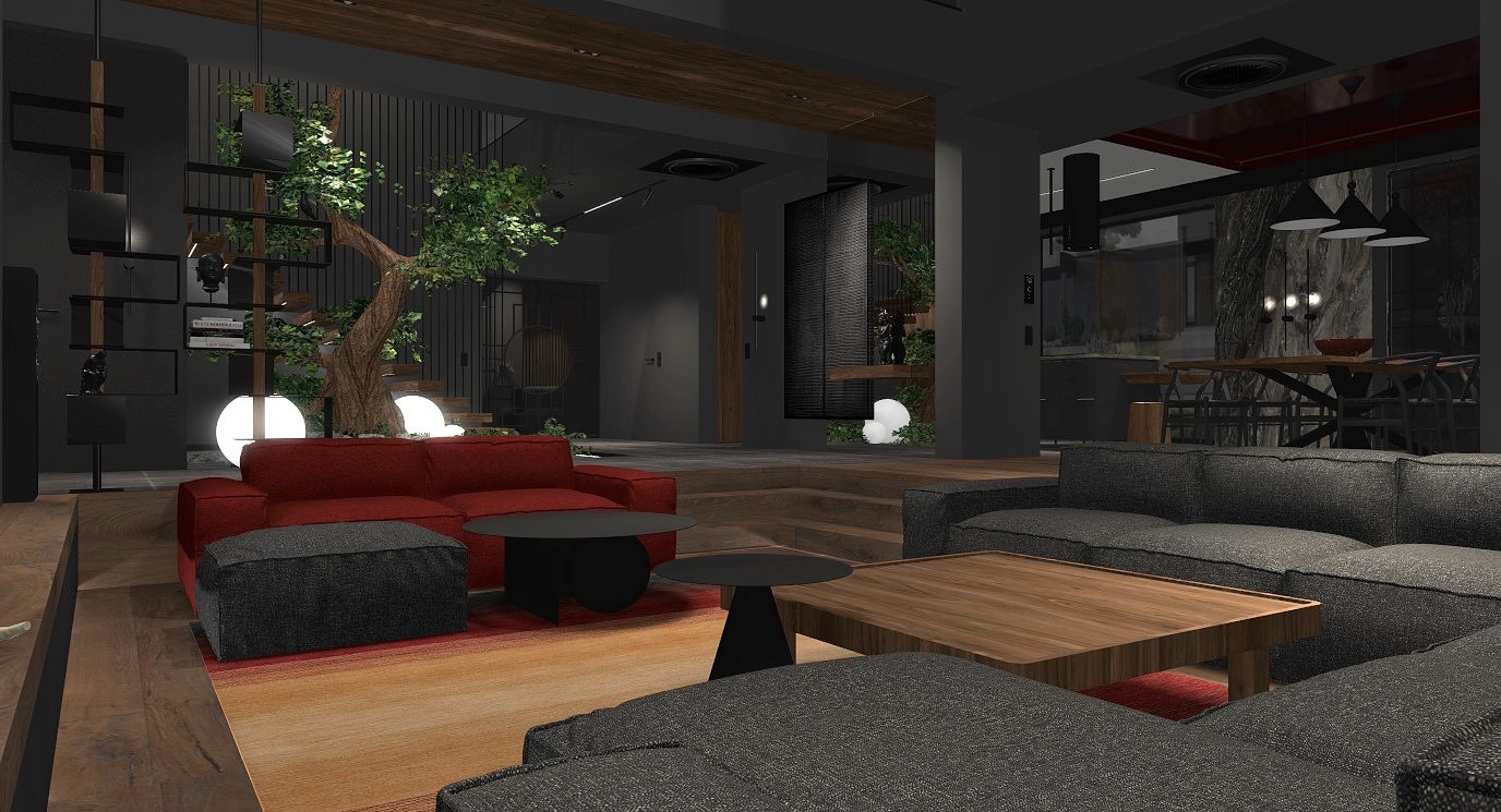 Nowoczesny salon z szarą sofą modułową, czerwonym narożnikiem, stolikami kawowymi i drzewem wewnątrz, oświetlonym kulami, na tle schodów i półek z dekoracjami.