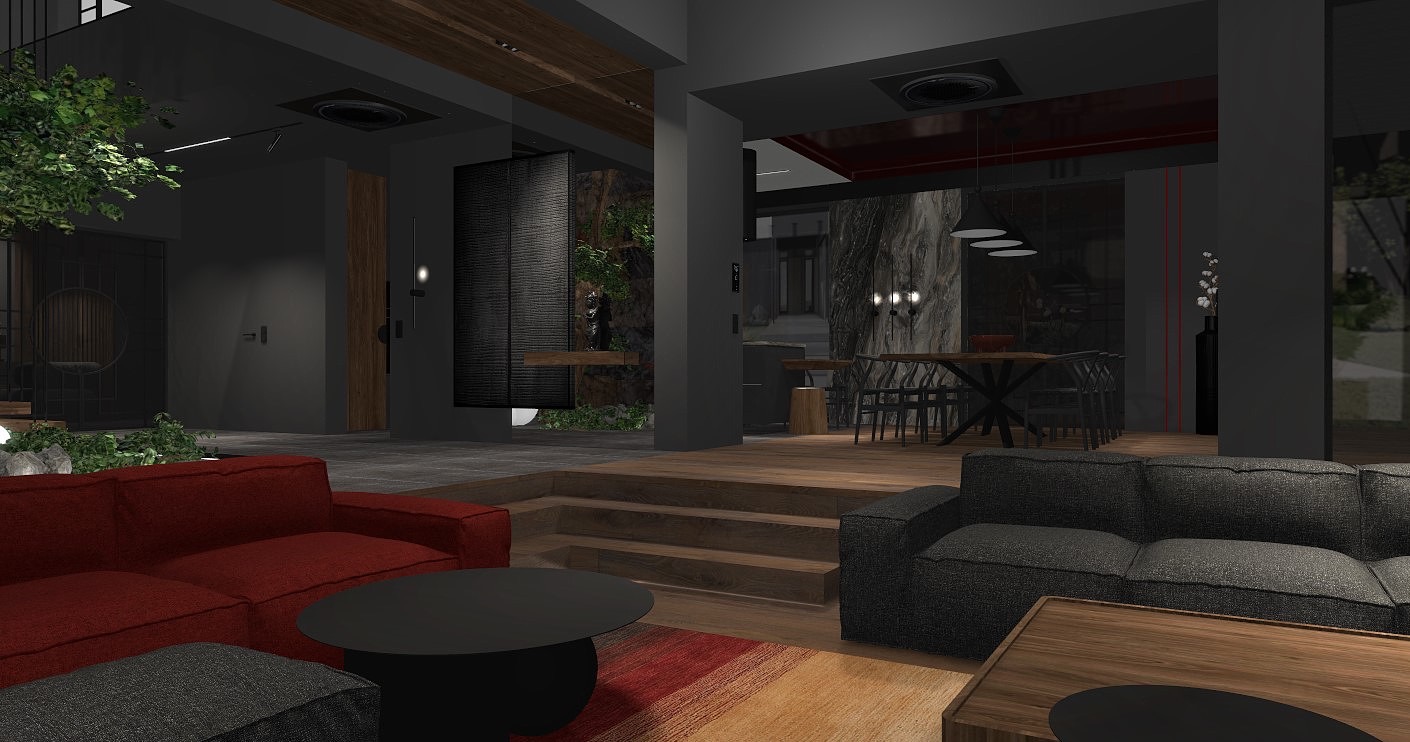 Nowoczesny salon z czerwonym i szarym narożnikiem, czarnym okrągłym stolikiem kawowym, drewnianymi schodami i elementami zieleni w tle.