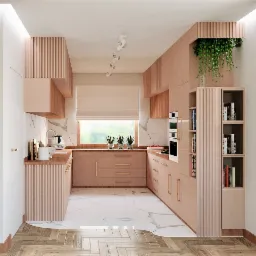 Kuchnia w odcieniach pudrowego różu z marmurowym blatem i drewnianą podłogą w jodełkę, widok na salon z tapetą w motywy roślinne.