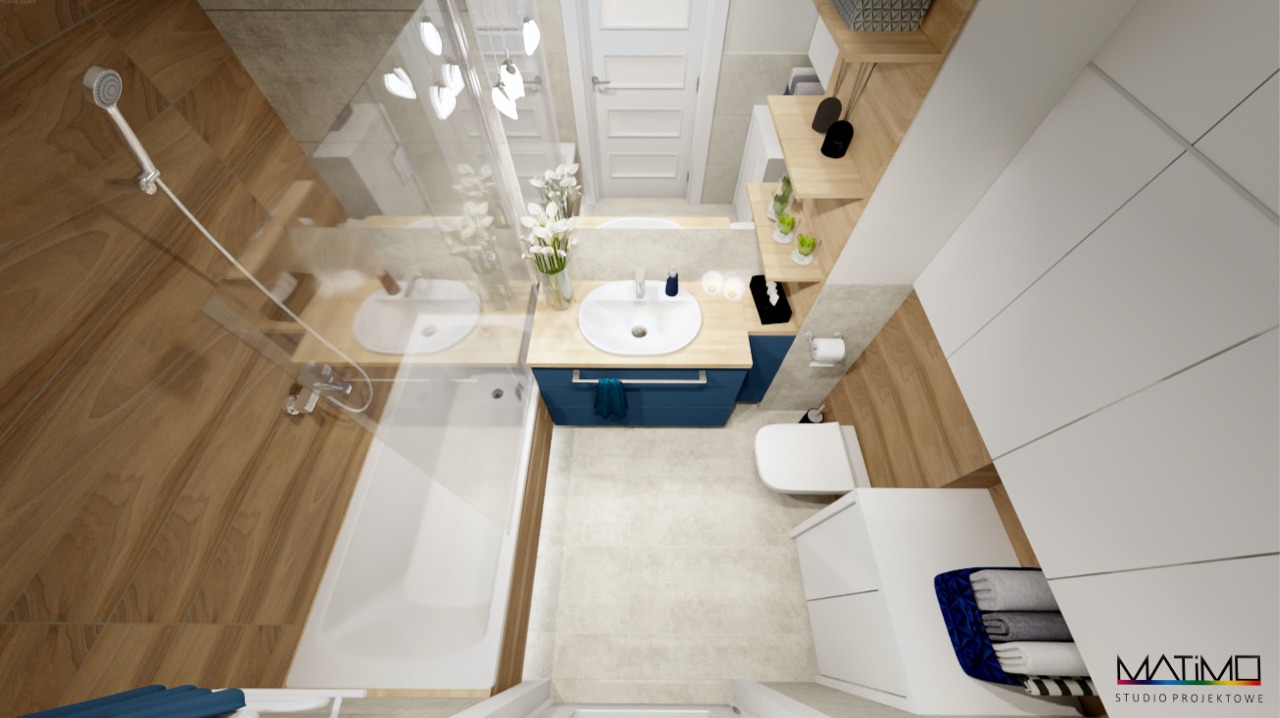 Wizualizacja łazienki z drewnianymi akcentami, niebieską szafką pod umywalką i białymi meblami, widziana z góry, prezentująca nowoczesny design i funkcjonalne rozwiązania.