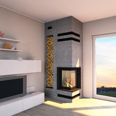 Nowoczesny narożny piec obłożony szarym kamieniem z czarnymi akcentami, z wnęką na drewno po lewej stronie paleniska. W tle widoczne okno z widokiem na zachodzące słońce.