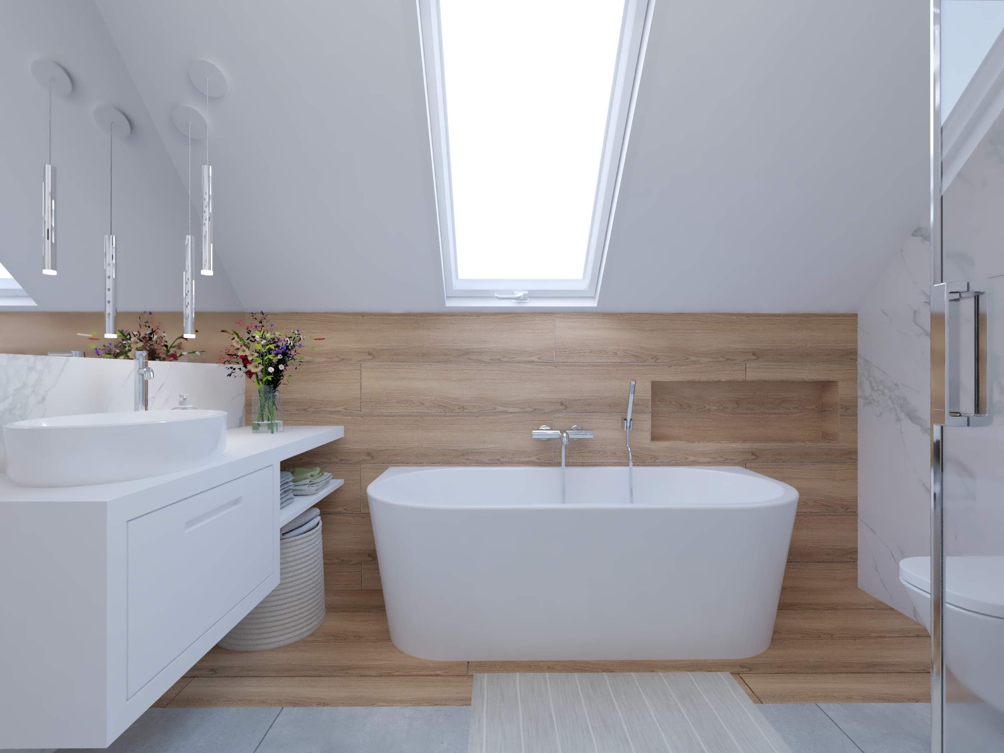 Nowoczesna łazienka na poddaszu z białą wolnostojącą wanną, umywalką nablatową na białej szafce, drewnopodobnymi płytkami na ścianie, oknem dachowym i wiszącymi lampami.