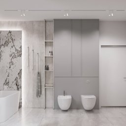 Eco Klima Mateusz Lipiński - Elegancka łazienka w odcieniach szarości i bieli. Marmurowe płytki, nowoczesna wanna, bidet, toaleta i szafki tworzą spójną, minimalistyczną przestrzeń.