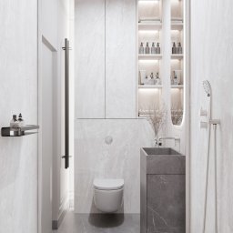 Eco Klima Mateusz Lipiński - Elegancka łazienka w odcieniach bieli i szarości. Marmurowe wykończenie ścian, wisząca toaleta, umywalka z szafką z ciemnego marmuru. Oświetlone półki z akcesoriami.