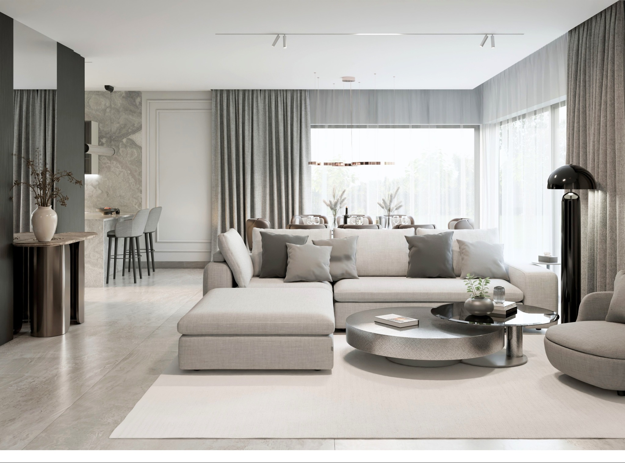 Nowoczesny salon z narożną sofą, okrągłym stolikiem kawowym i zasłonami w odcieniach szarości. Widoczna kuchnia z barkiem i krzesłami barowymi, eleganckie oświetlenie.