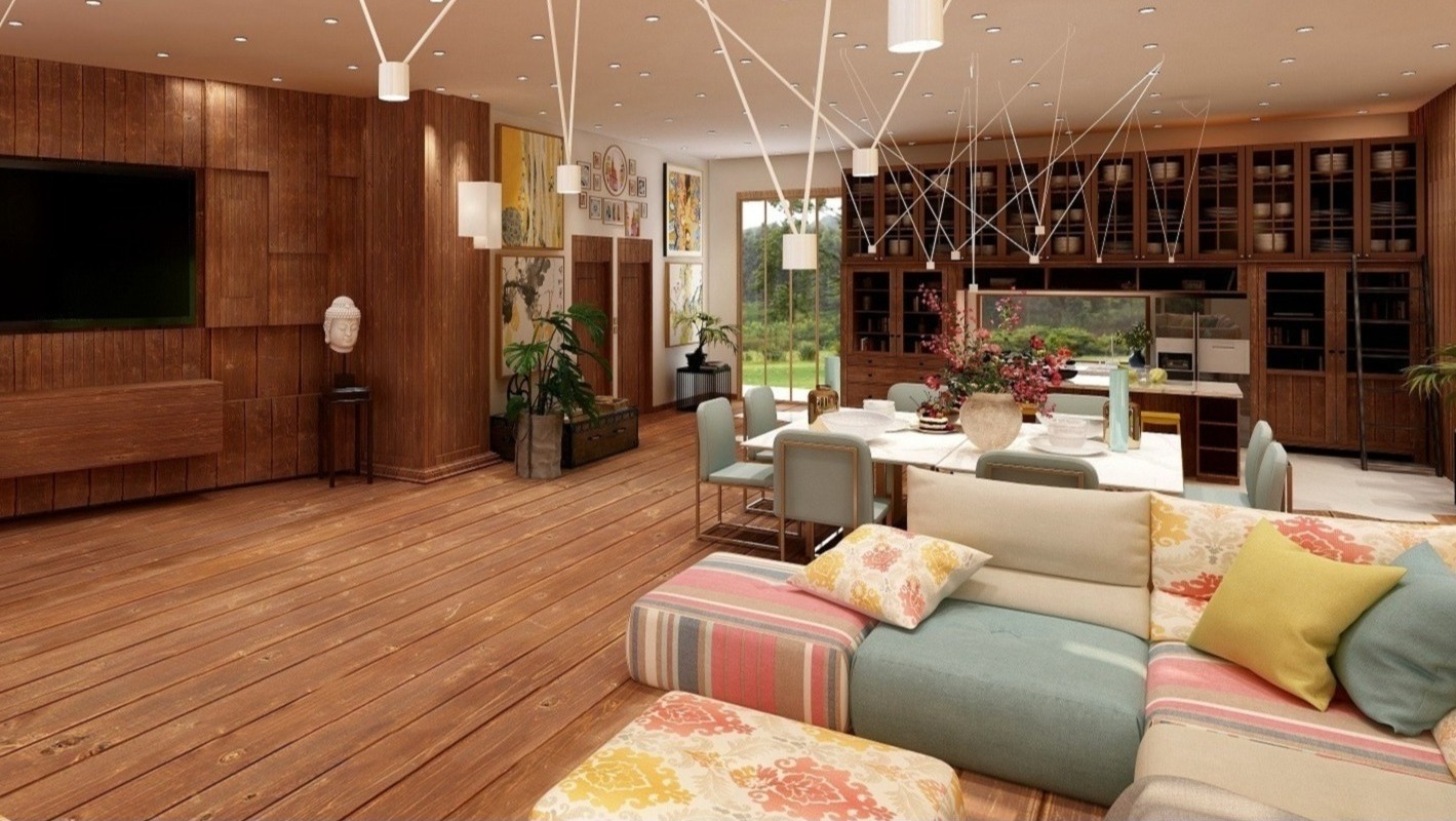 Przestronny salon z drewnianą podłogą i ścianą, nowoczesne oświetlenie punktowe, narożna sofa z wzorzystymi poduszkami, stół jadalny z krzesłami, zabudowa meblowa z przeszklonymi witrynami w tle.