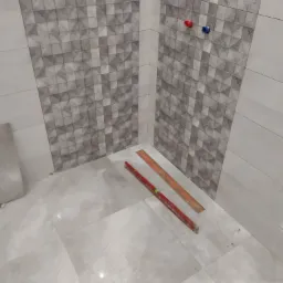 Świeżo ułożone, błyszczące płytki podłogowe i ścienne w łazience, z widocznymi poziomnicami i wystającymi rurami z ciepłą i zimną wodą, w trakcie prac wykończeniowych.