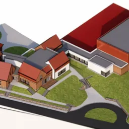 Wizualizacja 3D rozbudowy szkoły z halą sportową, ukazująca bryłę budynku z czerwonymi dachami i szarą halą sportową z boku, otoczoną zielonym terenem i drogą dojazdową.