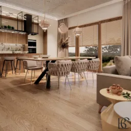 Jasne wnętrze: jadalnia z drewnianym stołem na czarnej nodze, plecione krzesła, drewniana podłoga, widok na kuchnię z drewnianymi szafkami i czarnym okapem, oraz salon z beżową sofą i stolikiem...