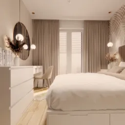 Neutralna sypialnia z dużym łóżkiem, toaletką z owalnym lustrem i dekoracjami z suszonych traw w wazonie, podkreślona przez wiszące lampy z kulistymi kloszami.