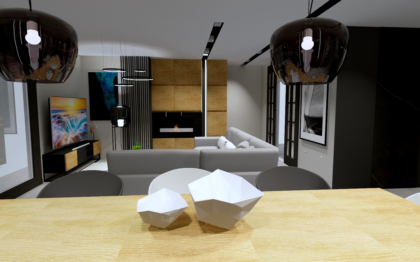 Wizualizacja salonu z jadalnią, z geometrycznymi dekoracjami na drewnianym stole, szarą sofą narożną i telewizorem z motywem morskim w tle, oświetlona wiszącymi lampami z ciemnego szkła.