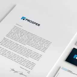 Papier firmowy z niebieskim logo i tekstem Lorem Ipsum, wizytówki z logo firmy na białym tle, minimalistyczny design.