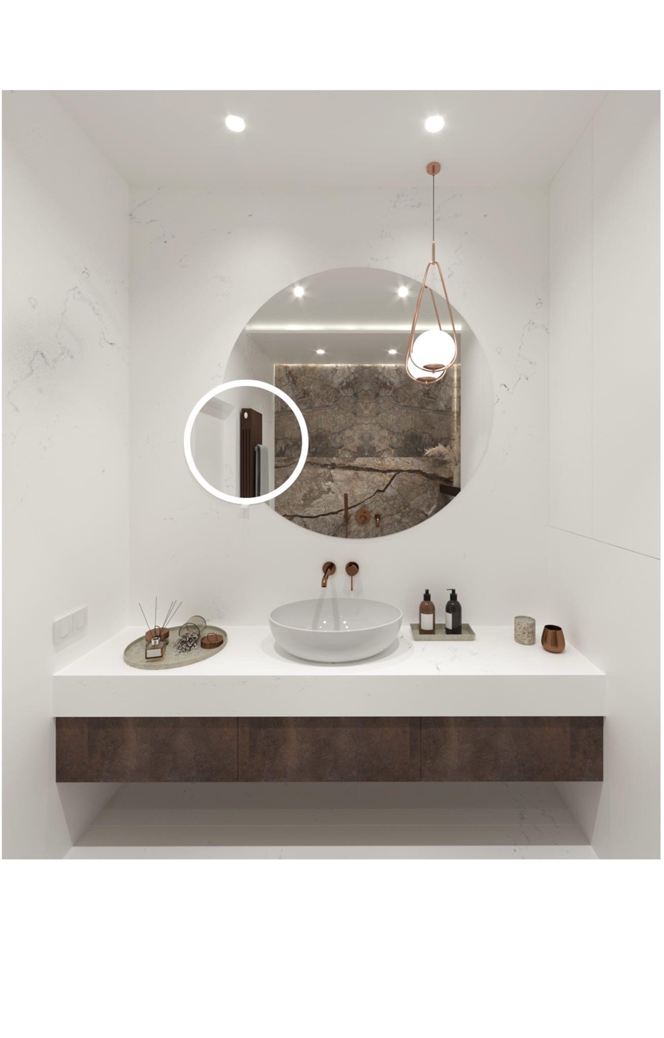 Nowoczesna łazienka z okrągłym lustrem podświetlanym LED, wiszącą lampą w kolorze miedzi i kamienną ścianą widoczną w odbiciu lustra.