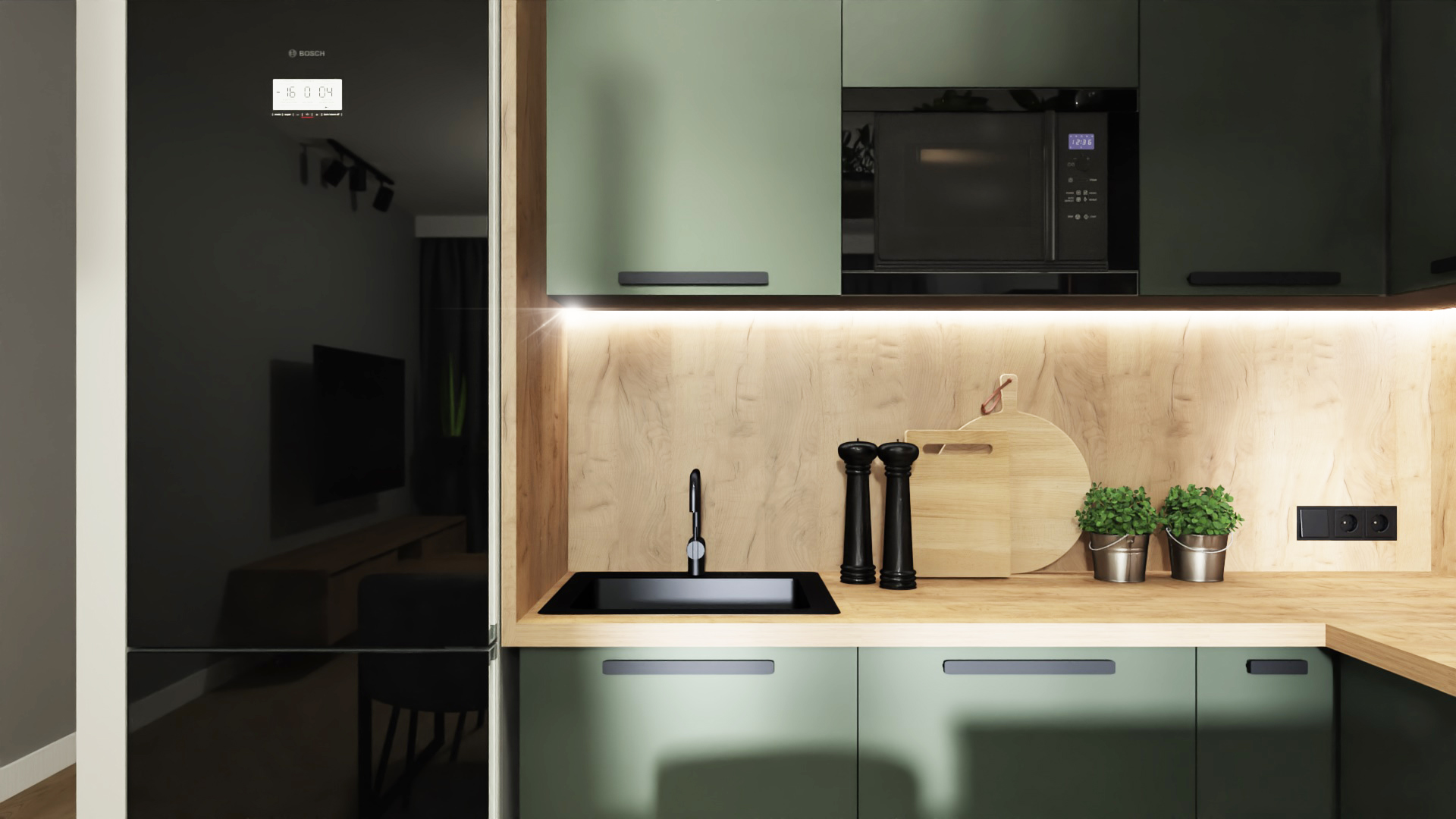 Nowoczesna kuchnia z zielonymi szafkami, drewnianym blatem, czarnym zlewem i armaturą, oświetleniem LED pod szafkami wiszącymi, czarną mikrofalówką i lodówką Bosch z wyświetlaczem. Na blacie deska...