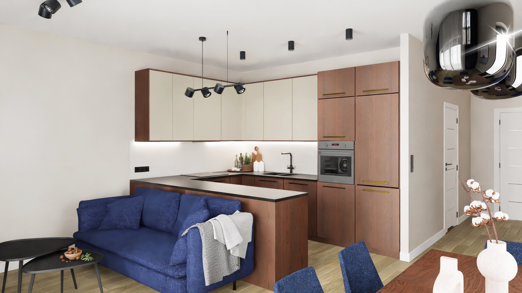 Wizualizacja otwartej kuchni z wyspą przechodzącą w sofę, drewniane szafki z kremowymi frontami, czarne lampy punktowe i wiszące, niebieska sofa z narzutą, stół z drewnianym blatem i niebieskimi...