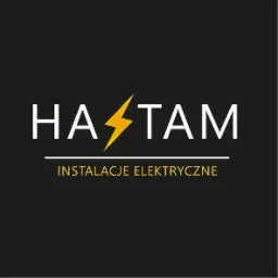 Logo firmy HA⚡️TAM z napisem 'INSTALACJE ELEKTRYCZNE' na czarnym tle, z żółtą błyskawicą w miejscu litery 'S'.