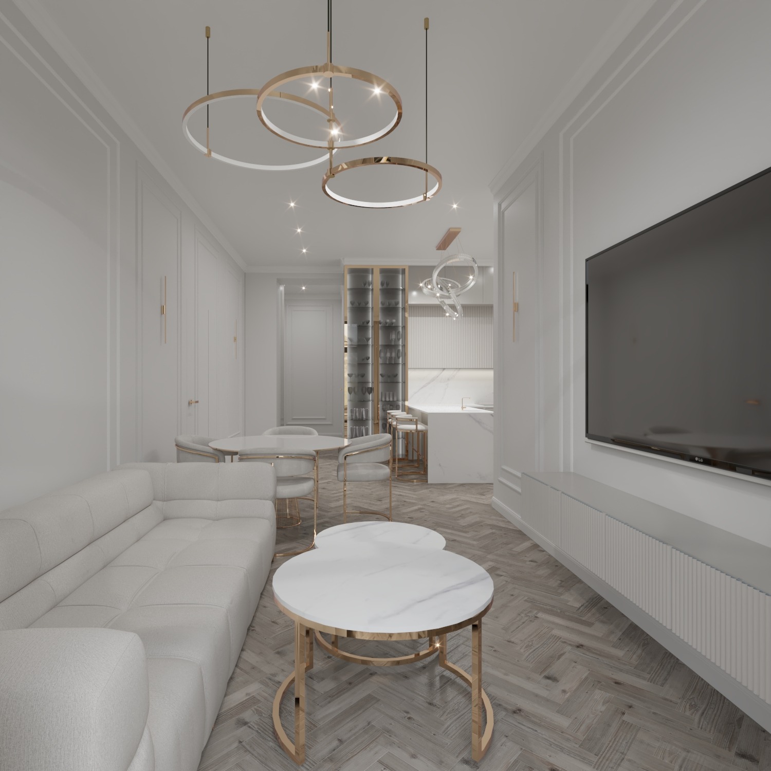 Elegancki salon w bieli i złocie: sofa, stoliki kawowe z marmurowymi blatami, okrągłe lampy. Parkiet w jodełkę, telewizor na ścianie. W tle widoczna kuchnia.